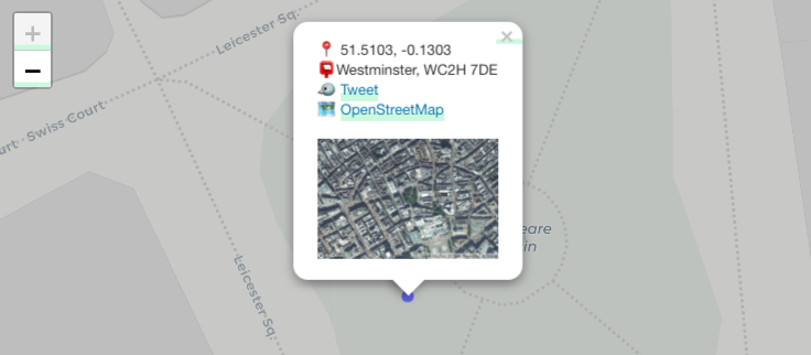 Screenshot of a leaflet map showing Leicester Square, London, with a popup giving geographic information and a satellite view.