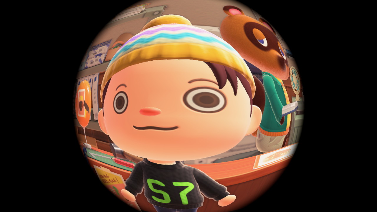 Fish-eye lens selfie of the player-character from the game Animal Crossing New Horizons. The character is wearing a knitted black hoodie with bright green letters that say 'S7'. The picture is taken in the Resident Services building. Tom Nook, a raccoon-dog character, is in the background staring ominously at the player.
