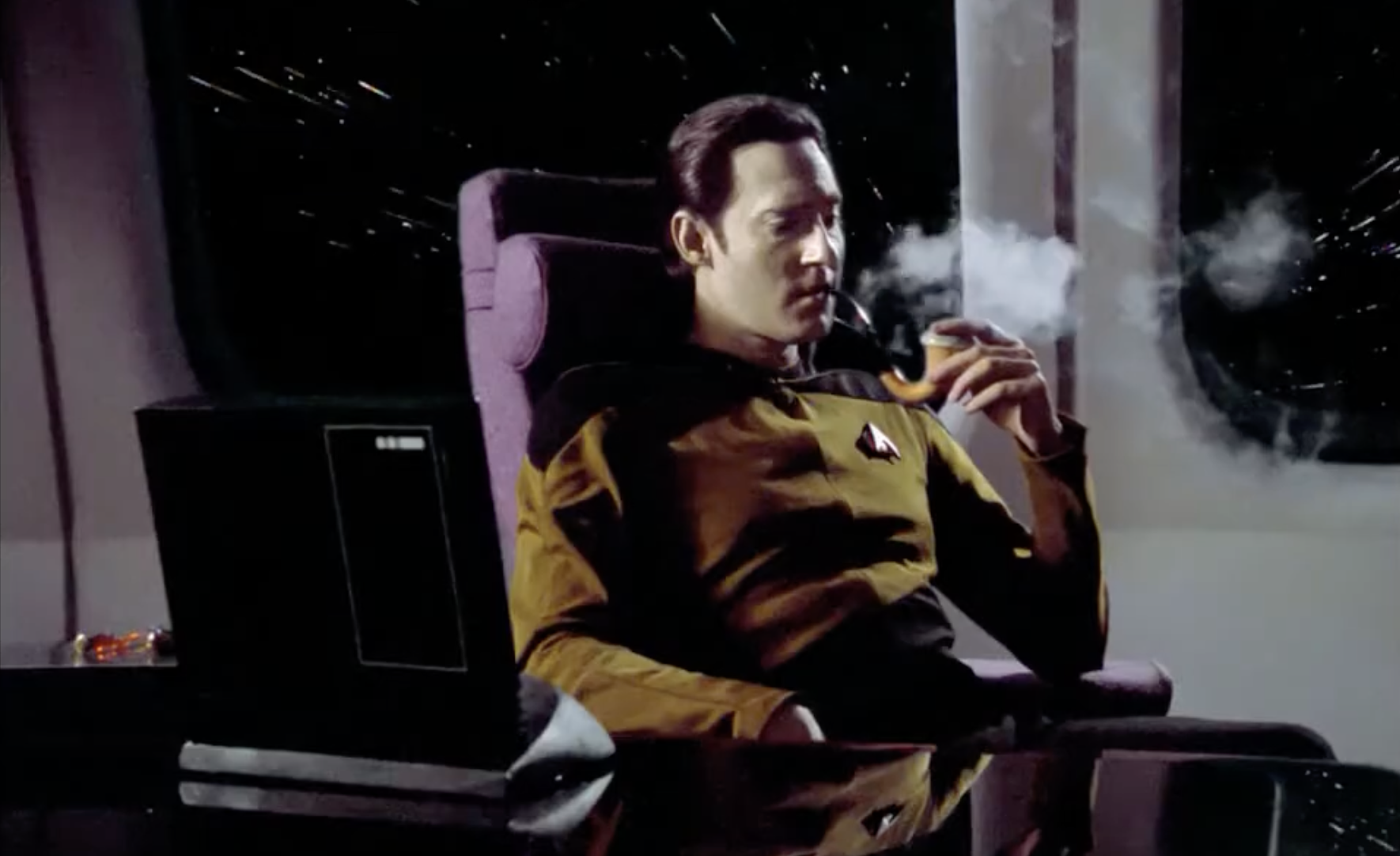 The character Data from Star Trek: The Next Generation is smoking a pipe.