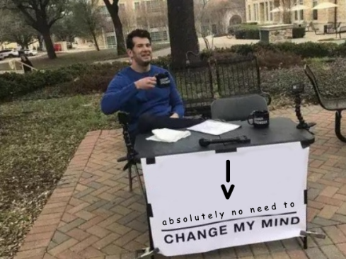 The 'change my mind' meme. A man sits at a table with a banner showing a made-up downward-pointing R assignment operator composed of a vertical pipe symbol with a letter v below it, and underneath it says 'absolutely no need to change my mind'.